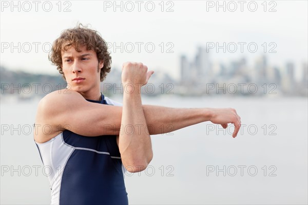USA, Washington State, Seattle, Young athlete doing workout. Photo: Take A Pix Media