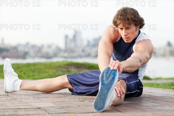 USA, Washington State, Seattle, Young athlete doing workout. Photo: Take A Pix Media