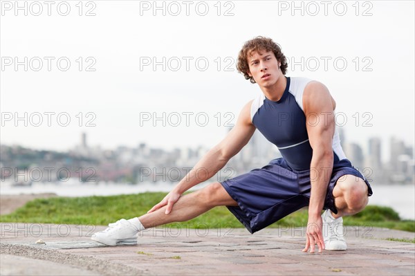 USA, Washington State, Seattle, Young athlete doing workout. Photo : Take A Pix Media