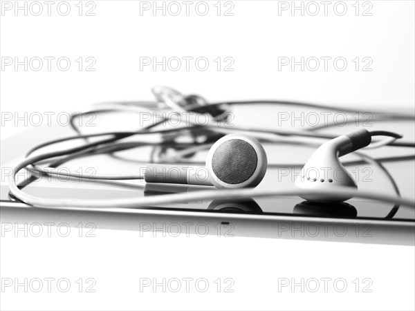 Studio shot of digital tablet and earphones. Photo : David Arky