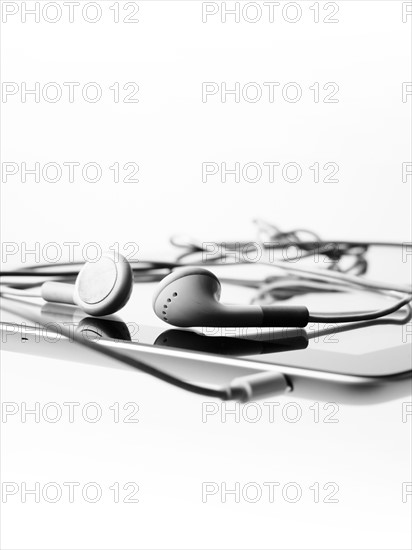 Studio shot of digital tablet and earphones. Photo : David Arky