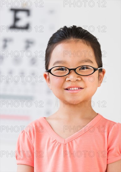 Girl (6-7) at eye exam.