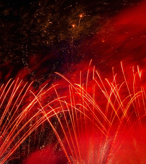 Fireworks explosion against night sky.