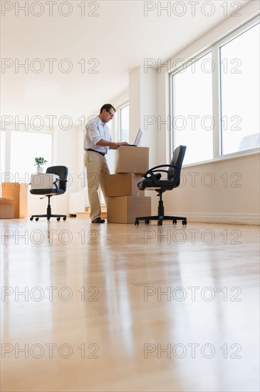 Businessman setting up office.