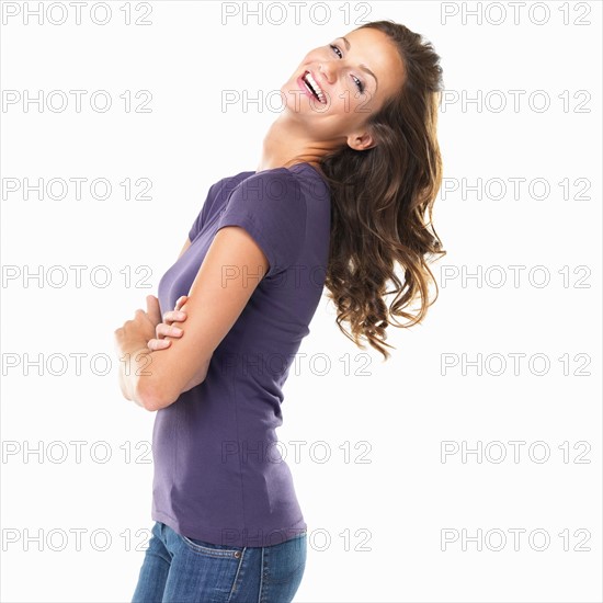 Studio portrait of attractive young woman smiling. Photo: momentimages