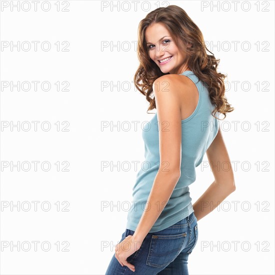 Studio portrait of attractive young woman smiling. Photo: momentimages