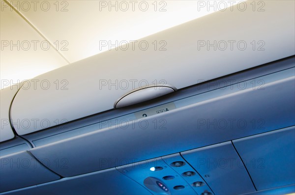 Overhead storage compartment in airplane.