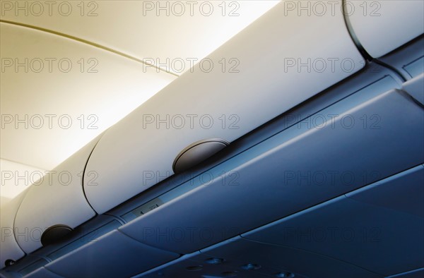 Overhead storage compartment in airplane.