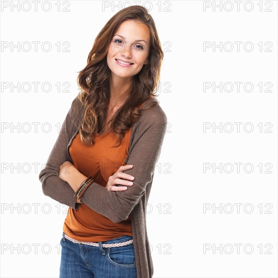 Studio shot of young woman smiling. Photo : momentimages