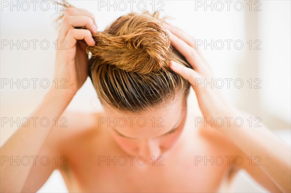 Woman washing hair.