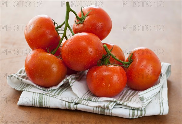 Fresh tomatoes on table.