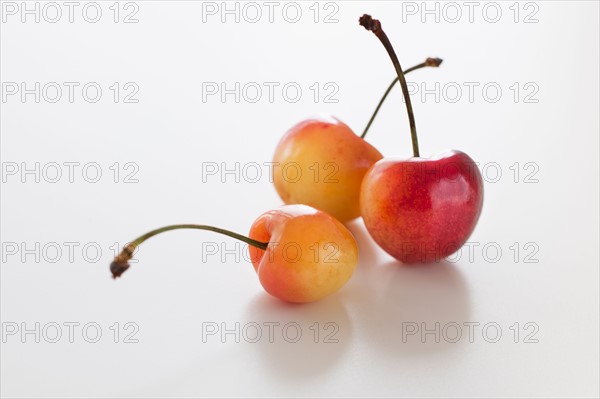 Fresh cherries on white background.