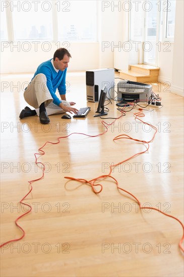 Businessman setting up internet in new office.