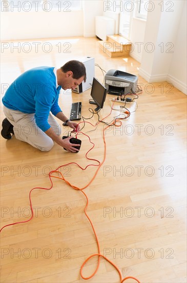 Businessman setting up internet in new office.