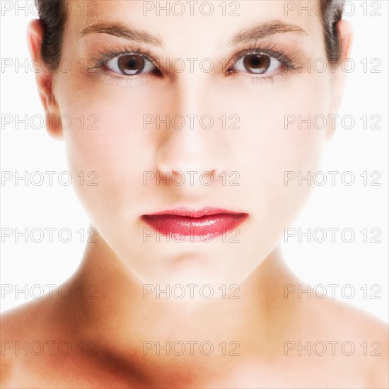 Studio portrait of young woman.