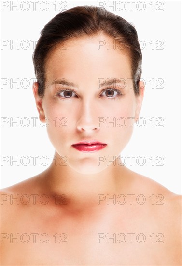 Studio portrait of young woman.