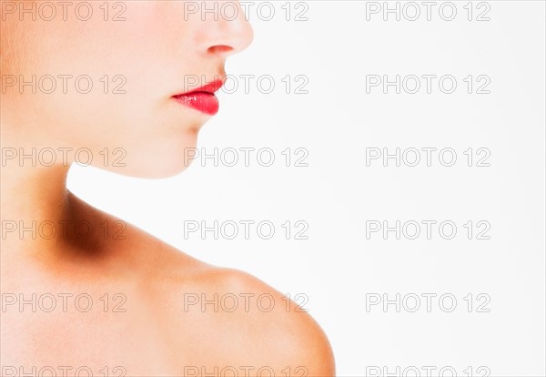 Studio shot of young woman wearing red lipstick.