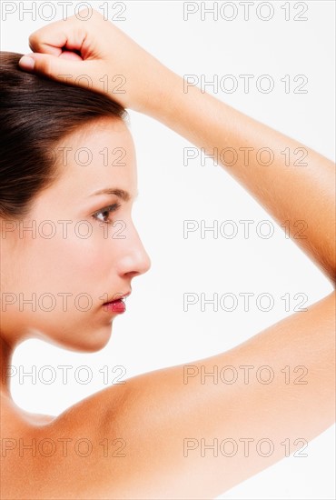 Studio portrait of young woman.