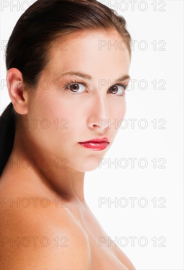 Studio portrait of young woman.