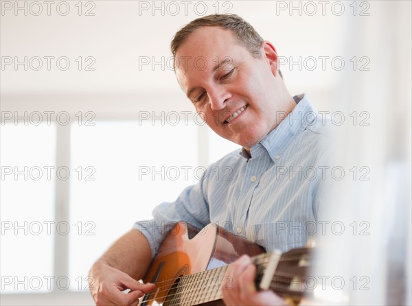 Man playing guitar. Photo: Jamie Grill