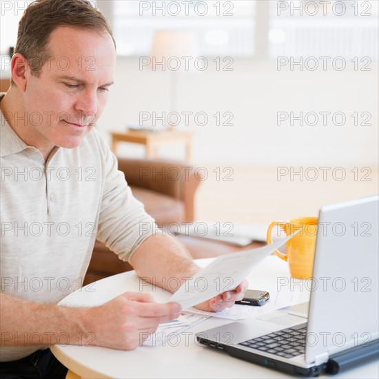 Man doing paperwork. Photo: Jamie Grill