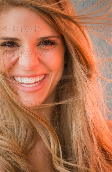 Portrait of smiling blonde woman. Photo : Jamie Grill