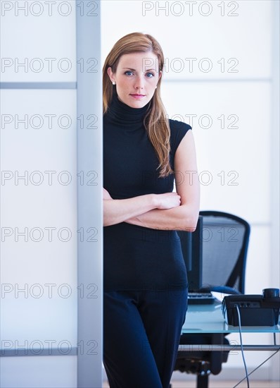 Young woman working in office. Photo: Daniel Grill