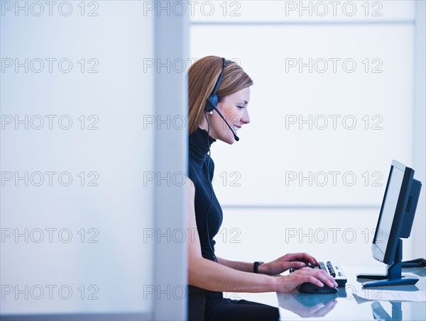 Young woman working in office. Photo: Daniel Grill