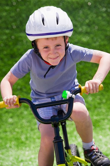 Boy (4-5) riding bike. Photo: Daniel Grill