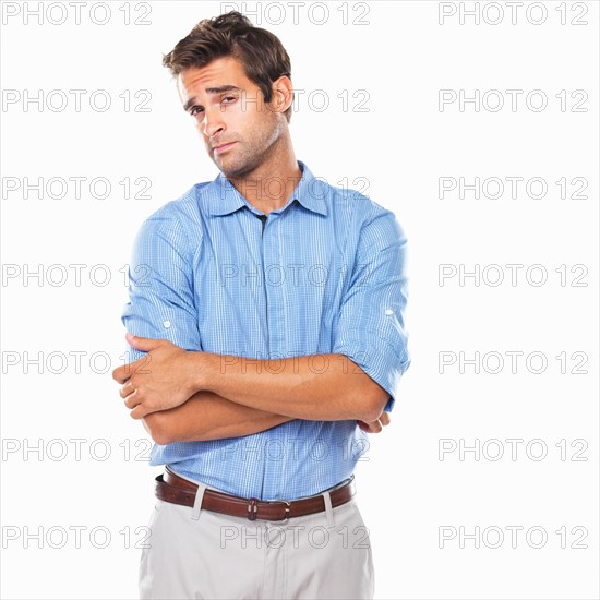 Portrait of curious executive standing with hands folded. Photo : momentimages