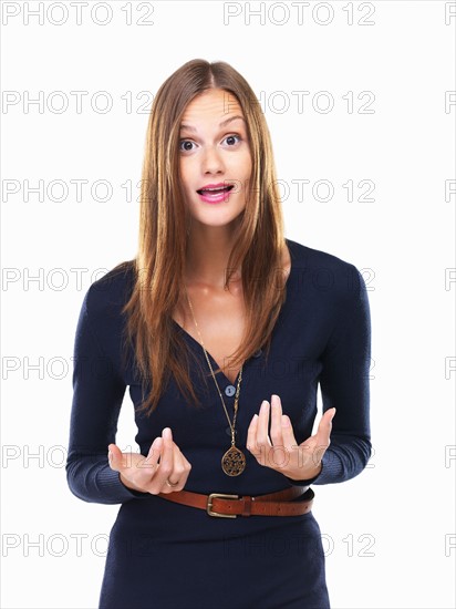 Studio portrait of looking at camera and gesturing. Photo: momentimages