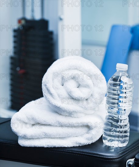 Close up of towel and bottle in gym. Photo: Daniel Grill