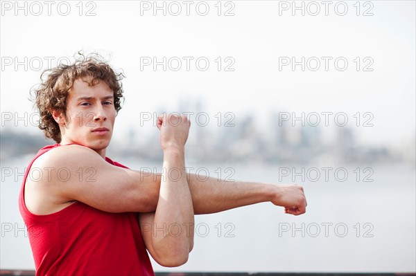 USA, Washington State, Seattle, Young athlete doing workout. Photo : Take A Pix Media