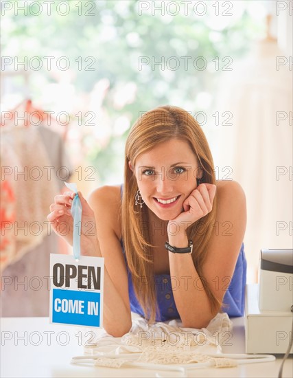 Young woman in clothes shop. Photo: Daniel Grill