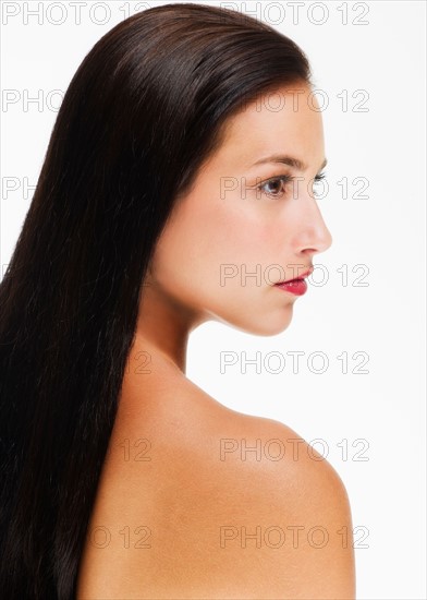 Studio portrait of young woman.