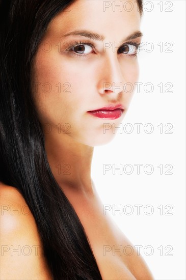 Studio portrait of young woman.