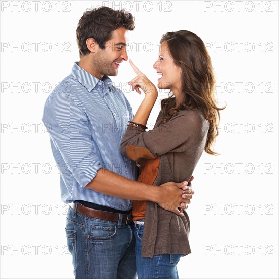 Studio shot of young playful couple. Photo: momentimages