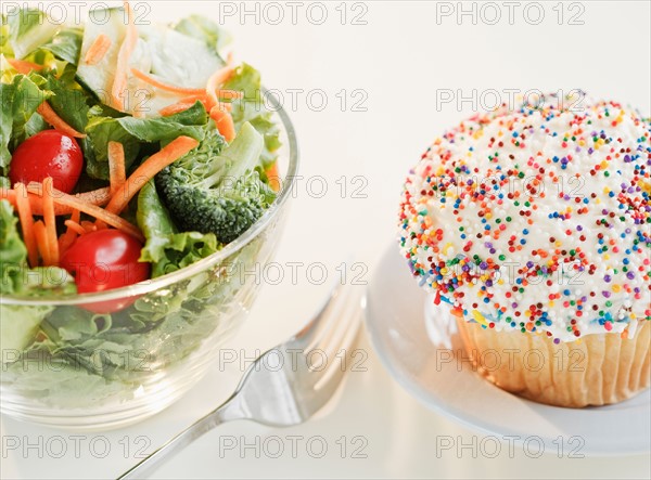 Comparison of cupcake and bowl of salad. Photo : Jamie Grill