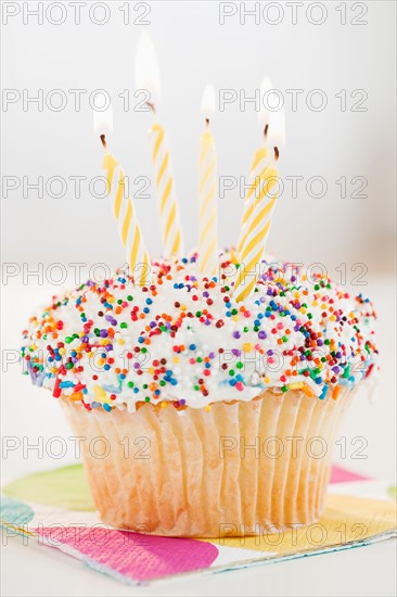 Cupcake with birthday candles. Photo : Jamie Grill