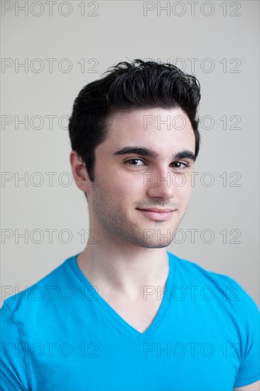 Studio portrait of smiling young man. Photo: Winslow Productions