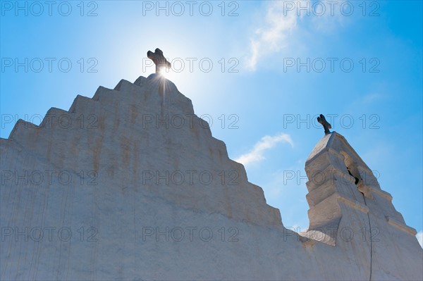 Greece, Cyclades Islands, Mykonos, Church bell tower with cross.