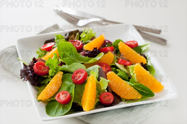 Fresh salad on plate.