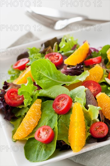 Fresh salad on plate.