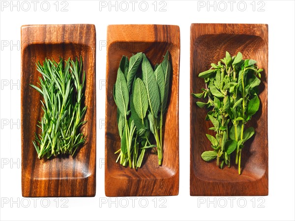 Studio shot of herbs on wooden trays. Photo : David Arky