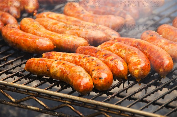 Sausages on barbeque.