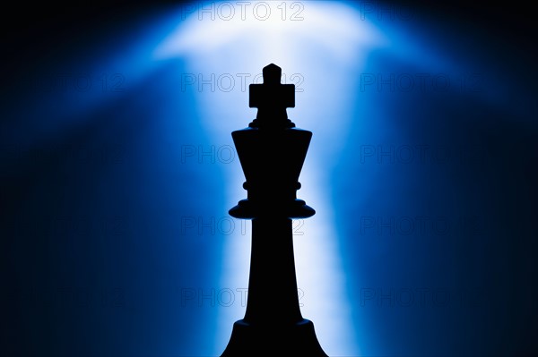 Illuminated king chess piece.