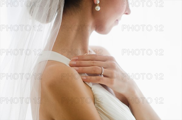 Bride wearing veil.