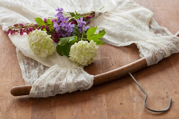 Flowers on dress with coat hanger.