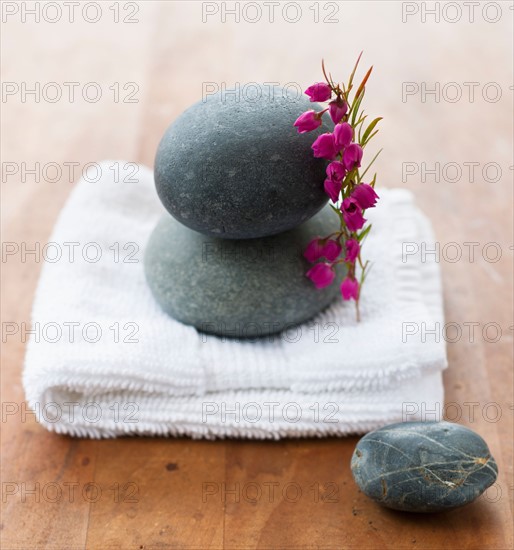 Stones on towel at spa.