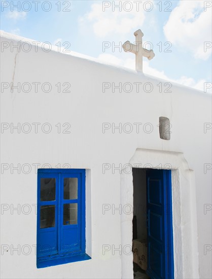 Greece, Cyclades Islands, Mykonos, Church with cross on roof.